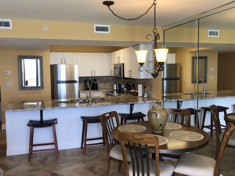 Dining table and kitchen area