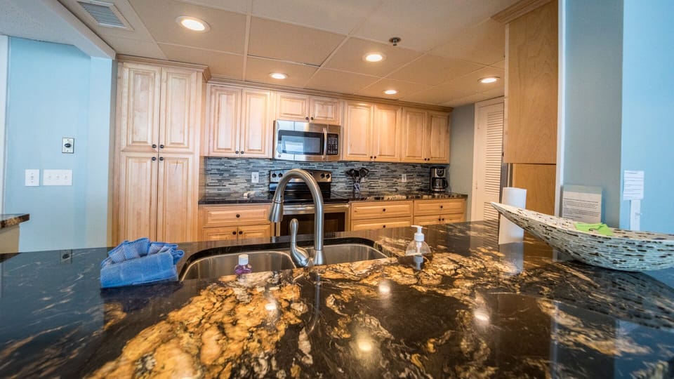 All new cabinets, remodeled kitchen, recessed lighting; laundry off kitcehn