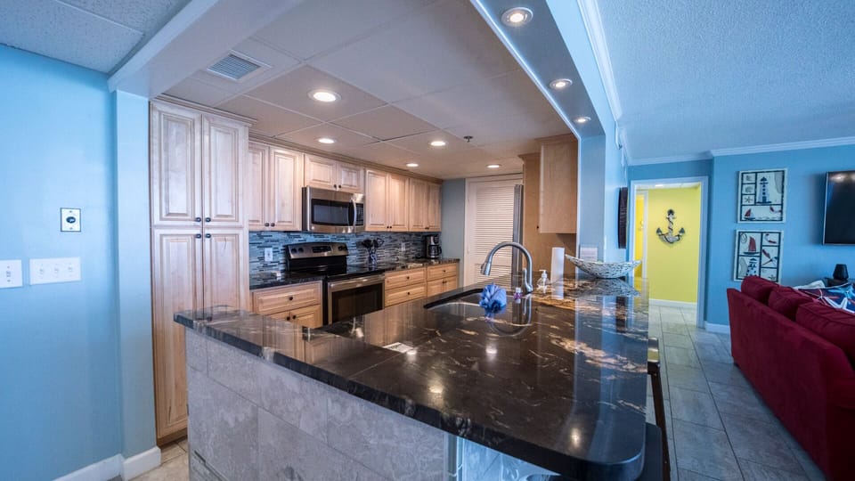 Recessed lighting above kitchen bar 