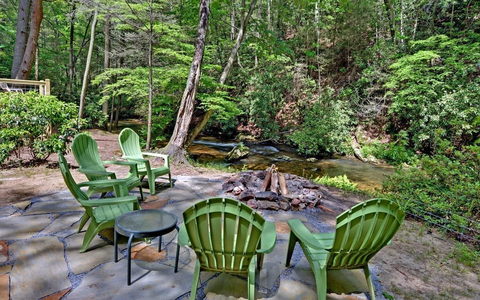 Stone patio and fire pit creekside