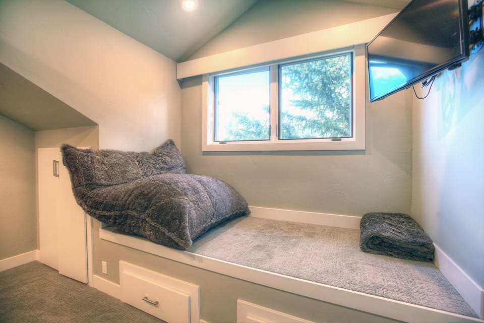 Previously, this was a loft. With the added dormer, big enough for a twin bed 