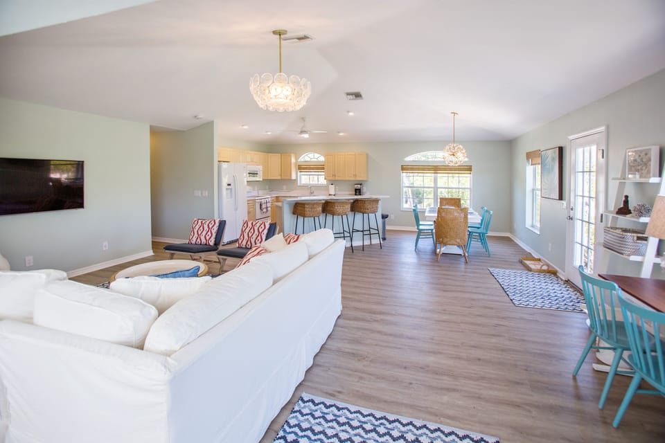 View from the living room overlooking the kitchen area.  Plenty of open space for anything you want to do on vacation!