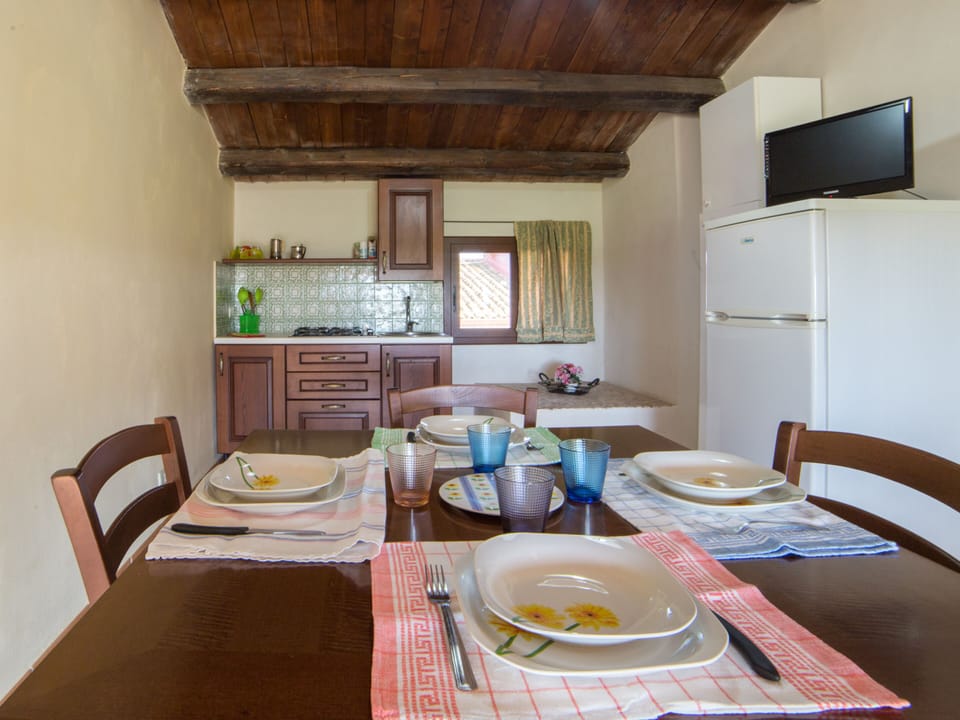 Apartment, 2 Bedrooms | Private kitchen | Full-size fridge, stovetop, coffee/tea maker, highchair
