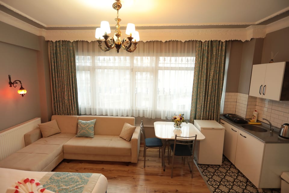 Family Room (Deluxe) | Living area | 40-inch flat-screen TV with satellite channels, LED TV, printers