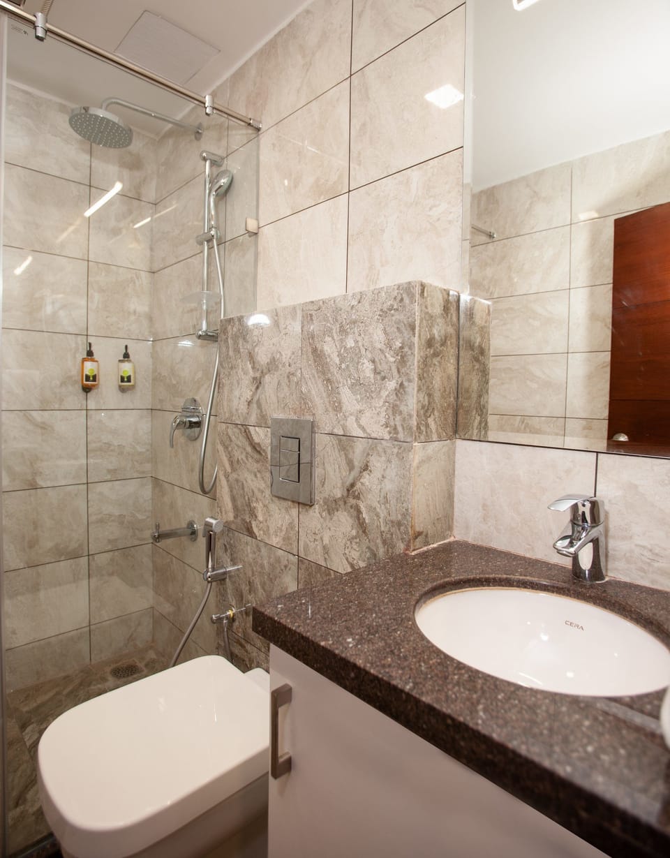 Mango Cozy Room | Bathroom | Shower, free toiletries, towels