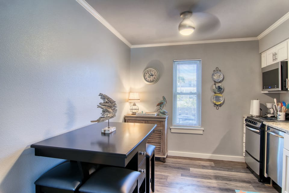 Living Area - Share meals and laughter in the stylish dining area, enhanced by the coastal ambiance and just steps from the kitchen.