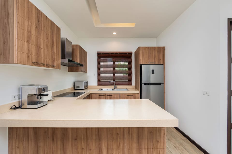 Villa | Private kitchen | Full-size fridge, microwave, oven, stovetop