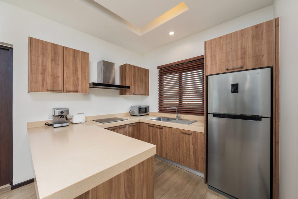 Villa | Private kitchen | Full-size fridge, microwave, oven, stovetop