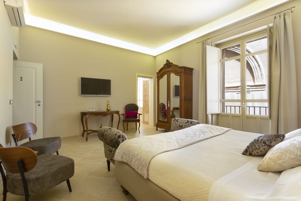 Junior Suite, Non Smoking, Balcony | In-room safe, blackout drapes, soundproofing, free WiFi