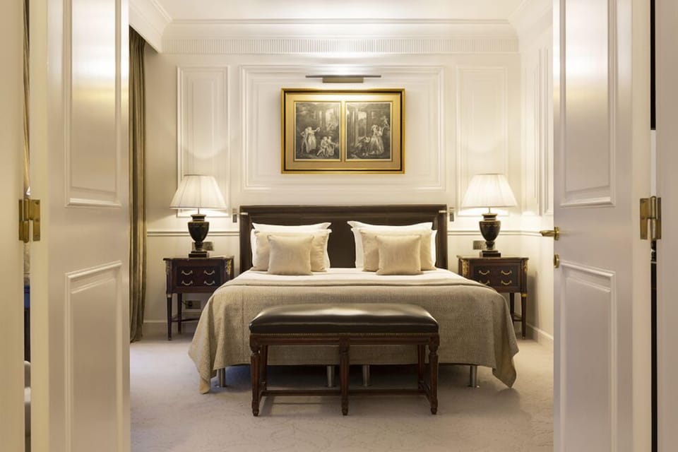 Superior Suite | Minibar, in-room safe, blackout drapes, iron/ironing board