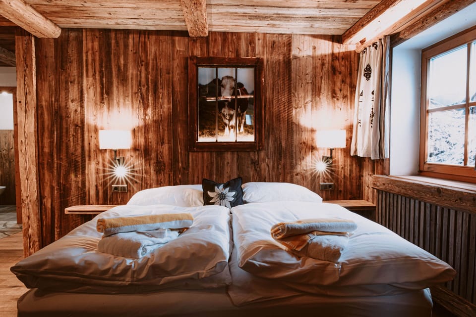 Suite, Sauna | Living area | Flat-screen TV, heated floors
