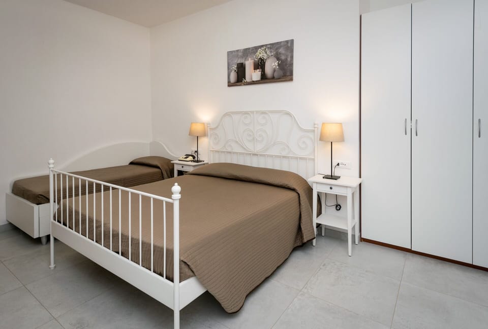 Standard Triple Room, Balcony | Minibar, in-room safe, desk, free WiFi