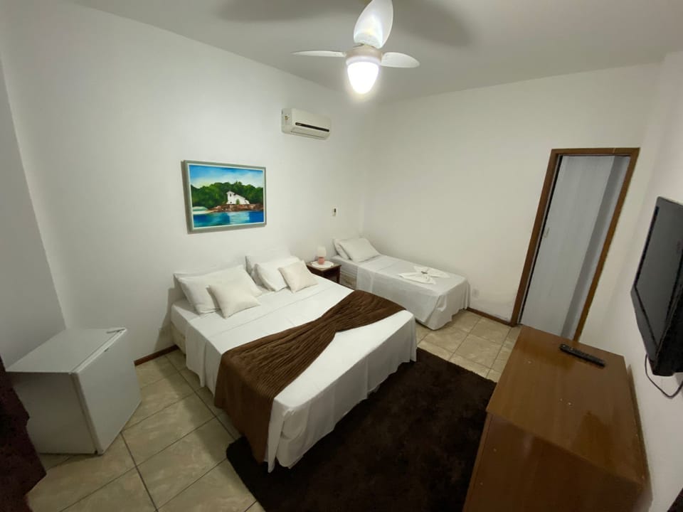 Standard Triple Room | Minibar, blackout drapes, iron/ironing board, free WiFi