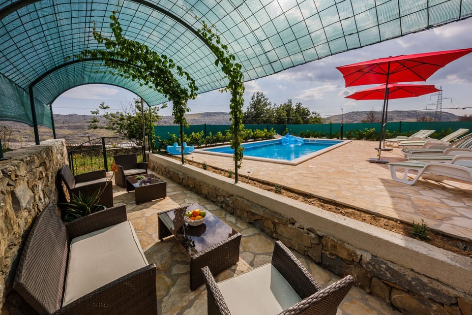 terrace with pool and seating area