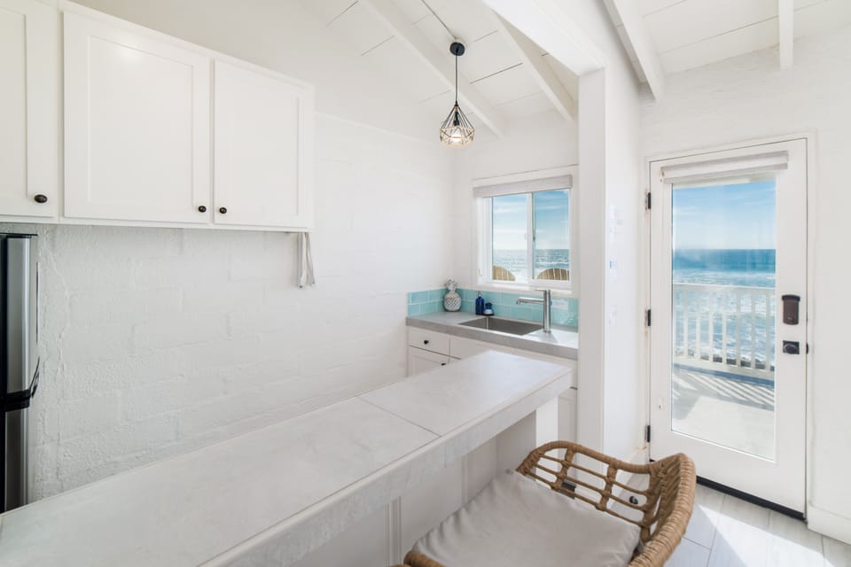 Ocean view kitchen and breakfast bar next to villa entrance