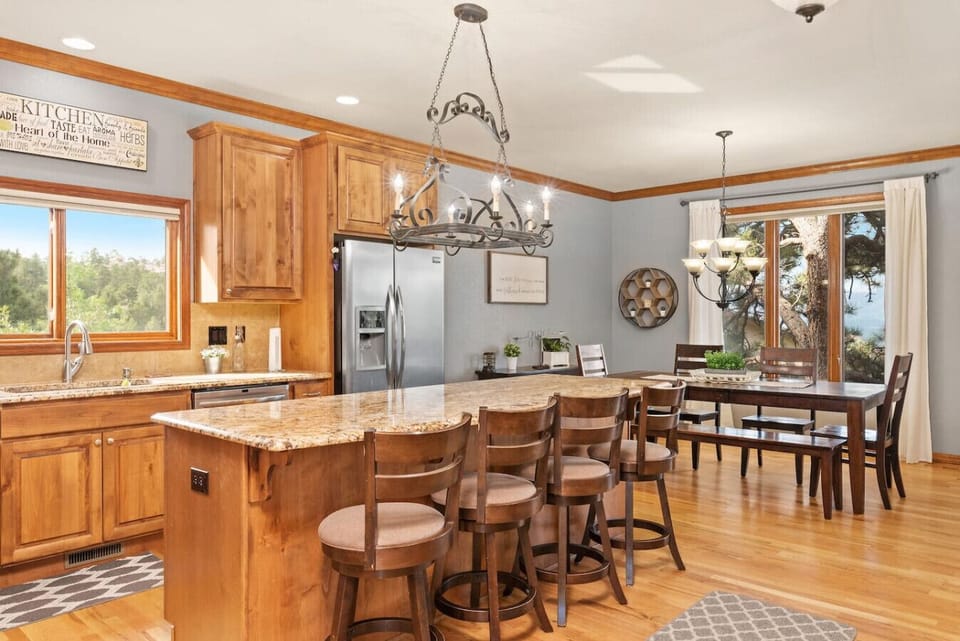 Gourmet kitchen open to great room, dining area, and breakfast table