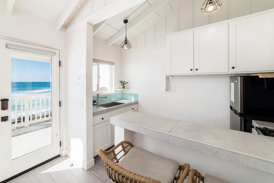 Ocean view kitchen and breakfast bar next to villa entrance