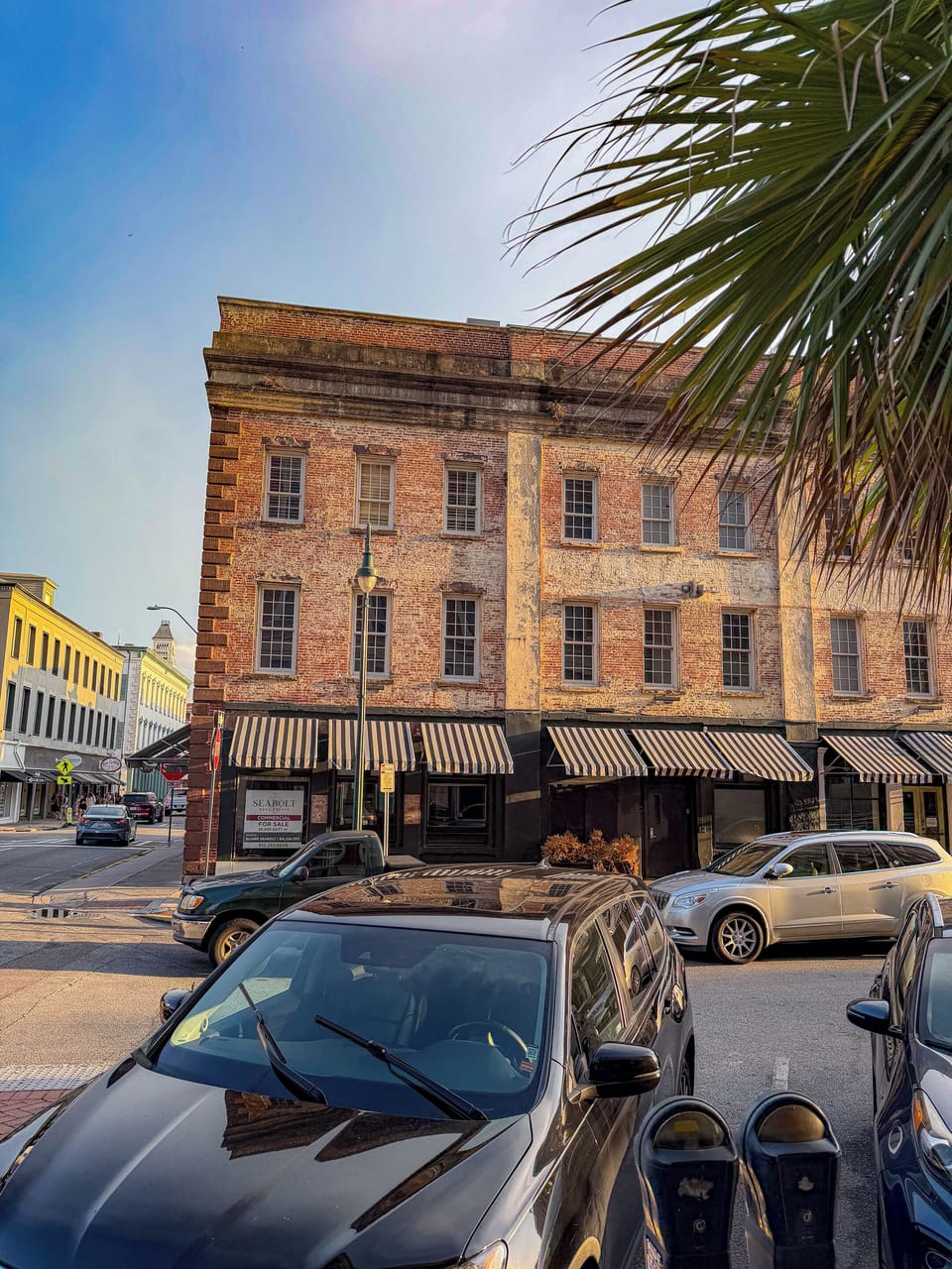 Historic downtown storefront with striped awnings and charming street views