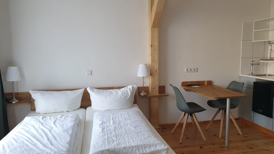 Double or Twin Room | Living area | Flat-screen TV