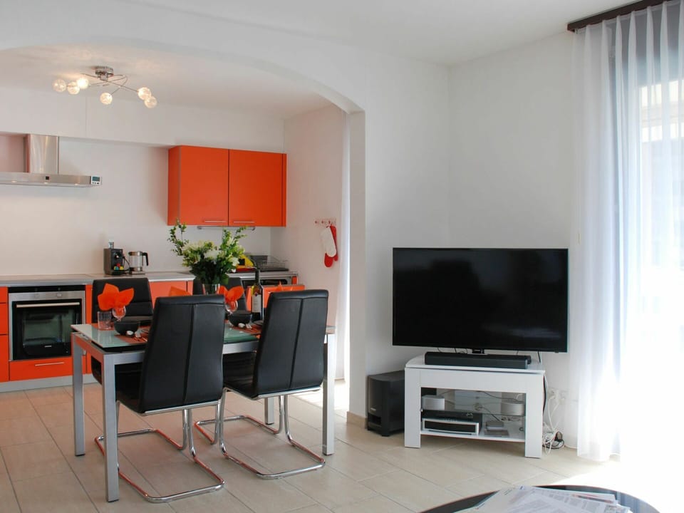 Furniture, Television, Couch, Houseplant, Building, Living Room, Chair, Comfort, Floor, Curtain