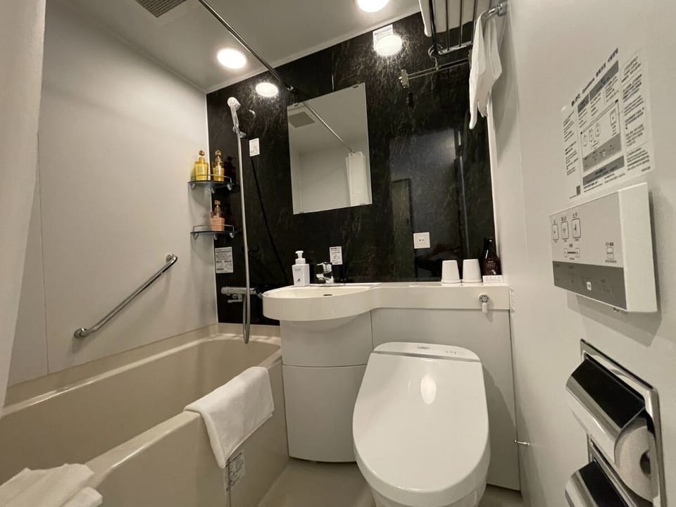 Standard Single Room, Non Smoking | Bathroom | Combined shower/tub, hair dryer, slippers, electronic bidet