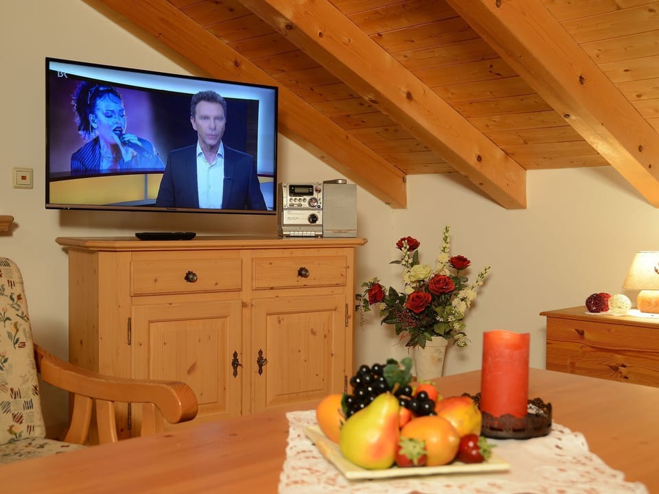 Apartment, Balcony, Mountain View | Living room | Flat-screen TV