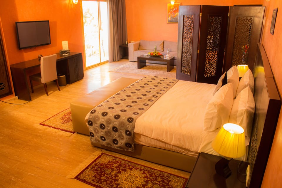 Luxury Suite, Pool View | Premium bedding, minibar, in-room safe, desk