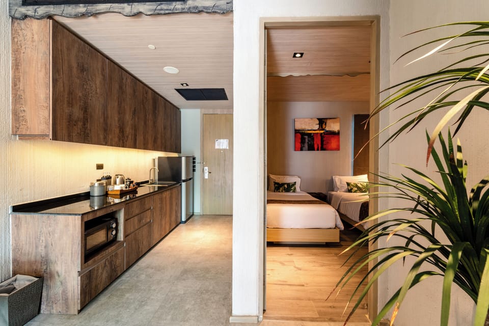 Two Bedroom Family Pool Suite | Minibar, in-room safe, desk, blackout drapes