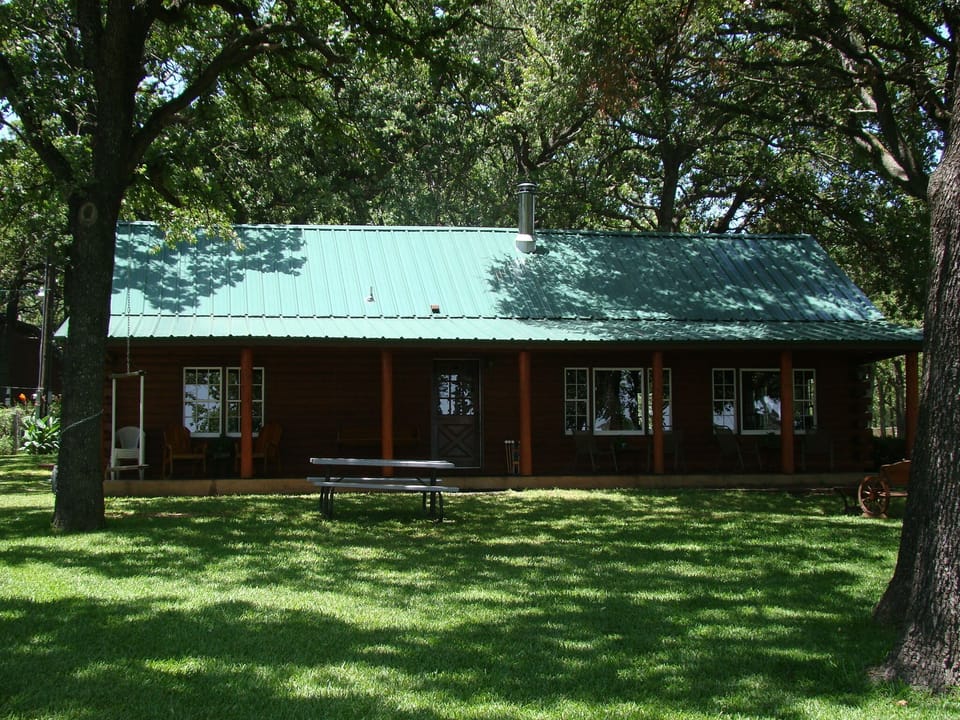 This was taken 7/11/15 after we added a green metal roof to the cabin.
