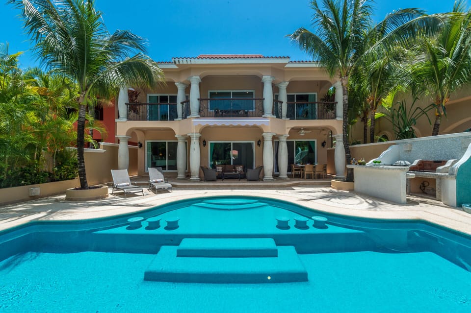 Warm inviting private pool, patio with lounge chairs, grill