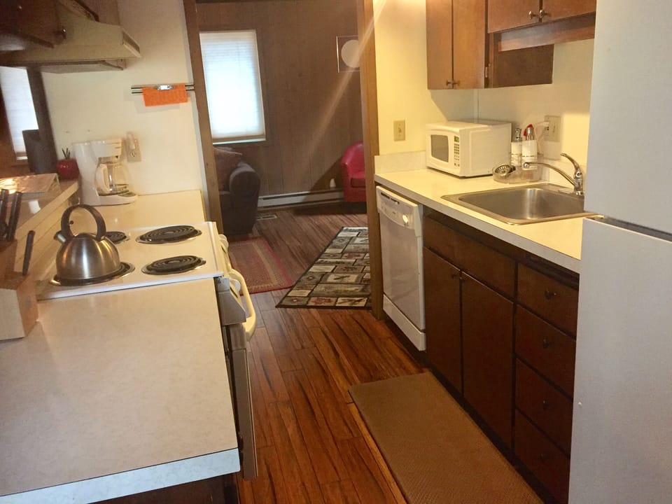 Well-stocked kitchen with coffee, tea, oil and spices 