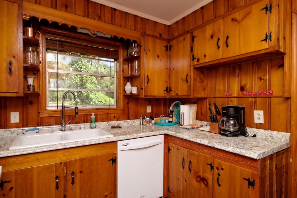 Full kitchen in a country feeling space.  Coffee maker and dishwasher too.