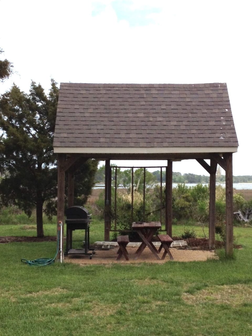 Picnic gazebo with gas grill, picnic table and climbing roses