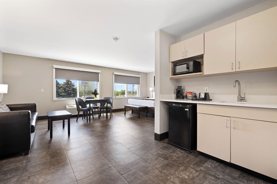 Suite, 1 King Bed (Junior King Suite) | In-room safe, blackout drapes, iron/ironing board, WiFi (free)