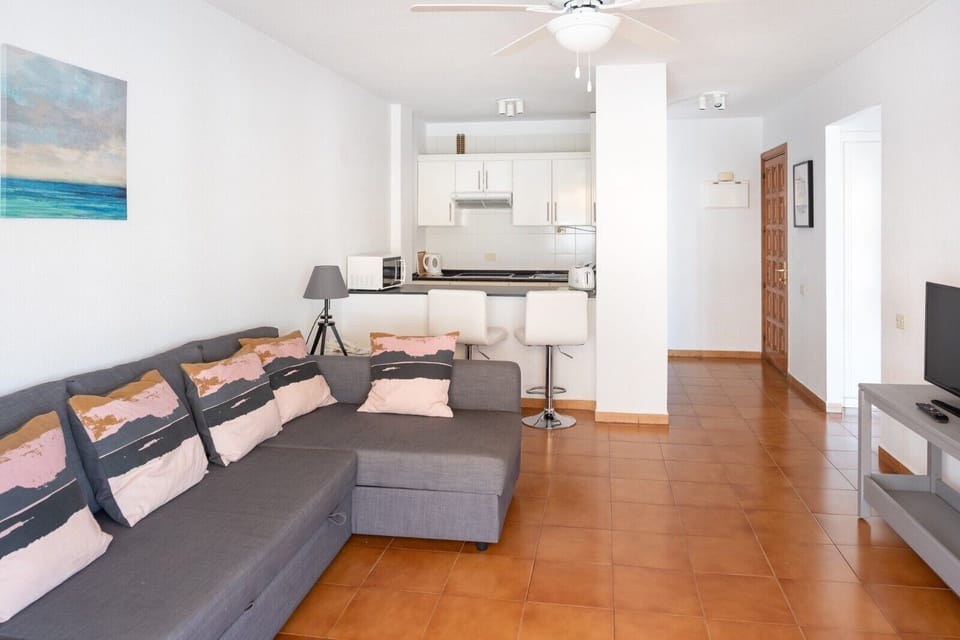 Standard One Bedroom | Living area | Flat-screen TV