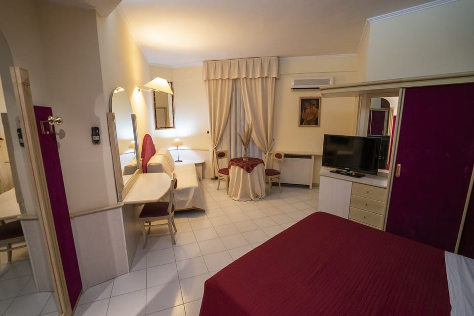 Double or Twin Room | Living area | Flat-screen TV