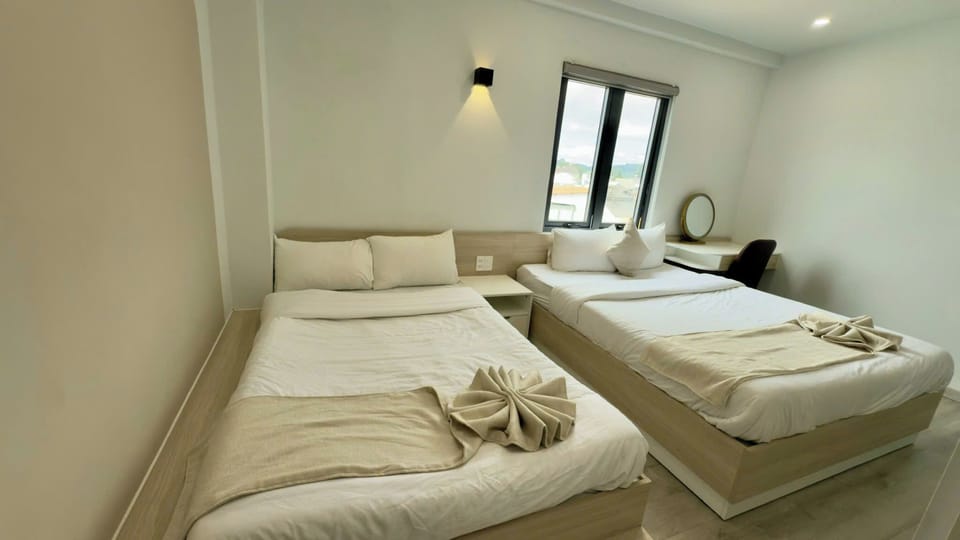Deluxe Quadruple Room | Minibar, desk, iron/ironing board, free WiFi
