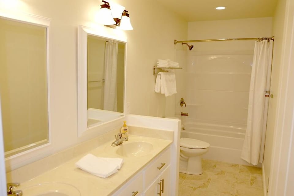 Upstairs bath has a double-sink vanity.  