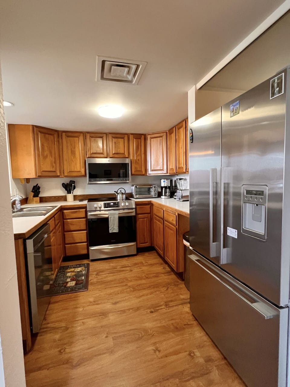 Kitchen with all new appliances including dishwasher and wine cooler. 