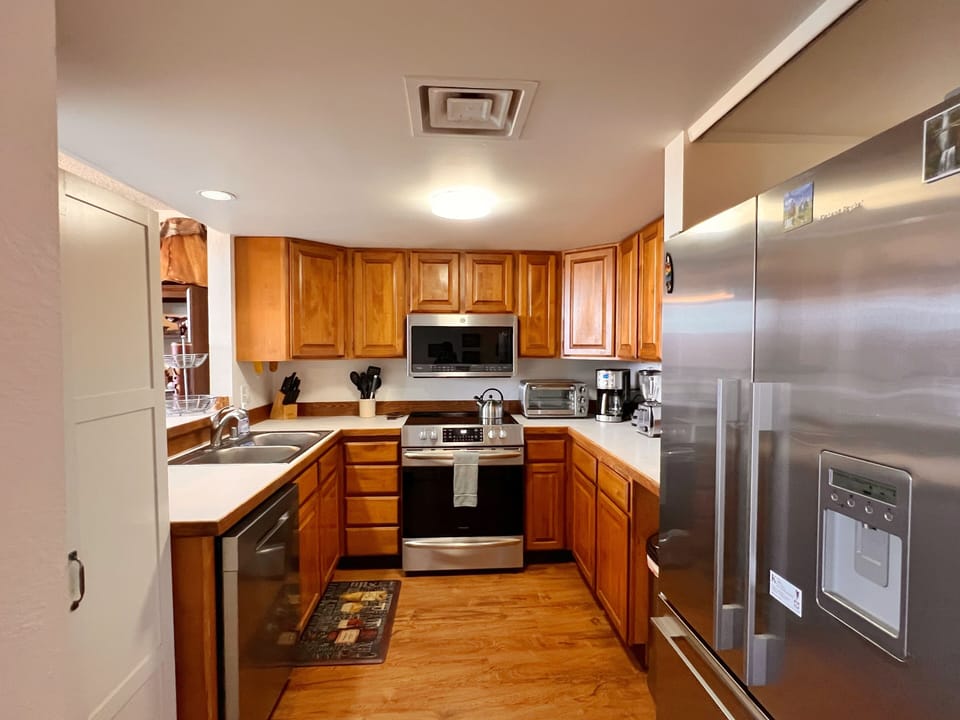 Kitchen with all new appliances including dishwasher and wine cooler. 