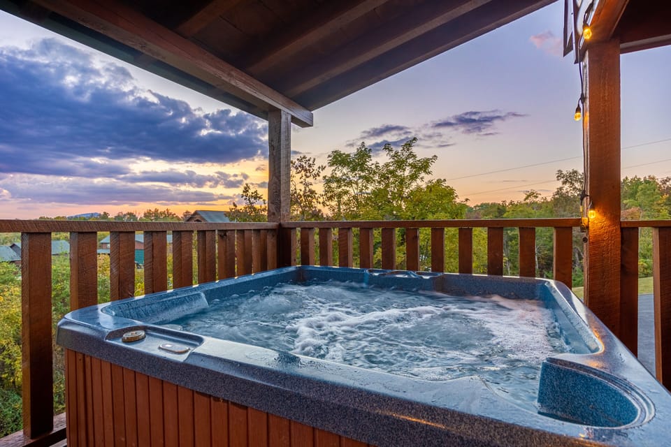 top level hot tub with a view of the mountains
