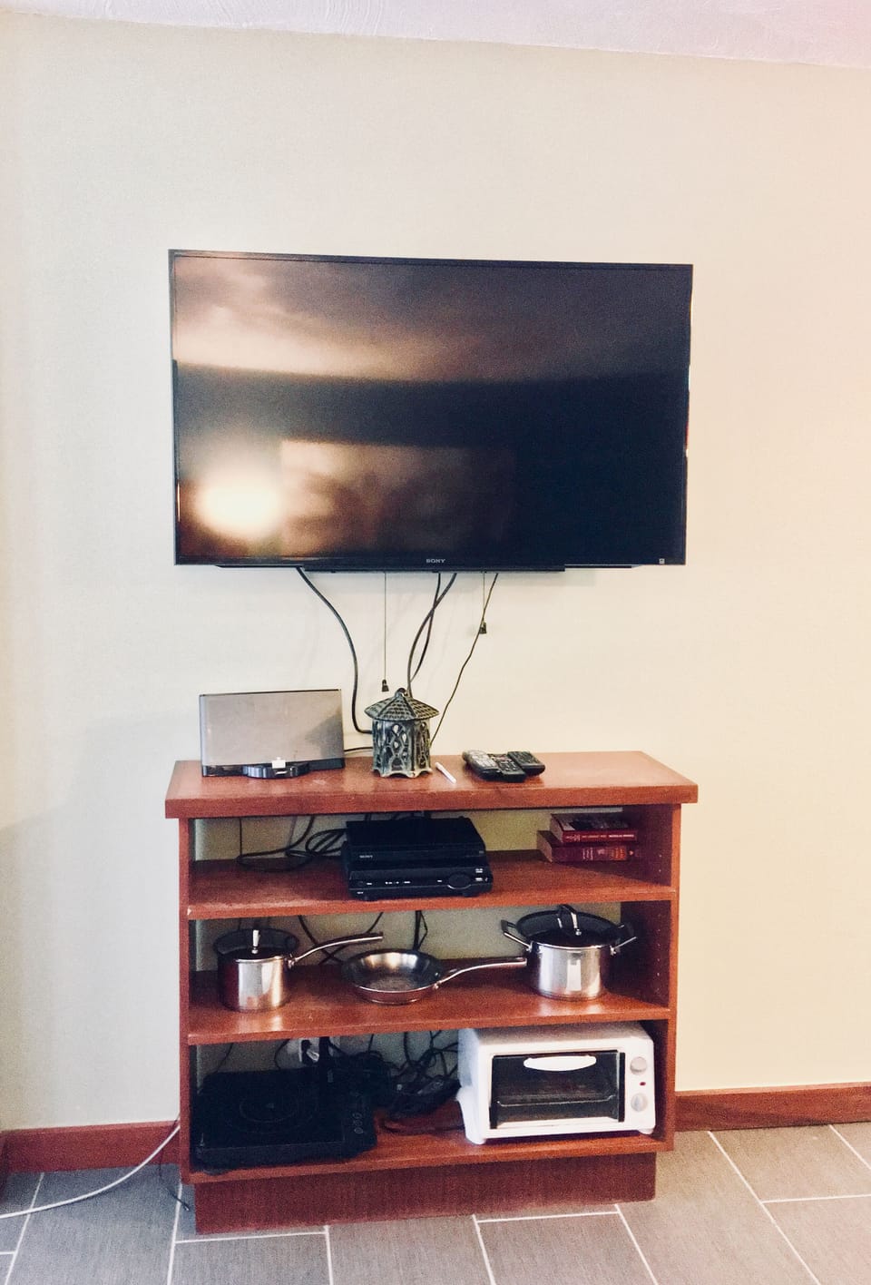 Shelves with kitchen equipment and multimedia 