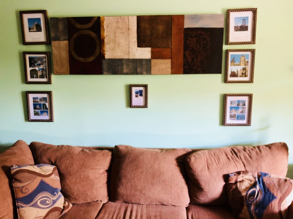 Spacious living room with large sectional sofa and coffee table 
