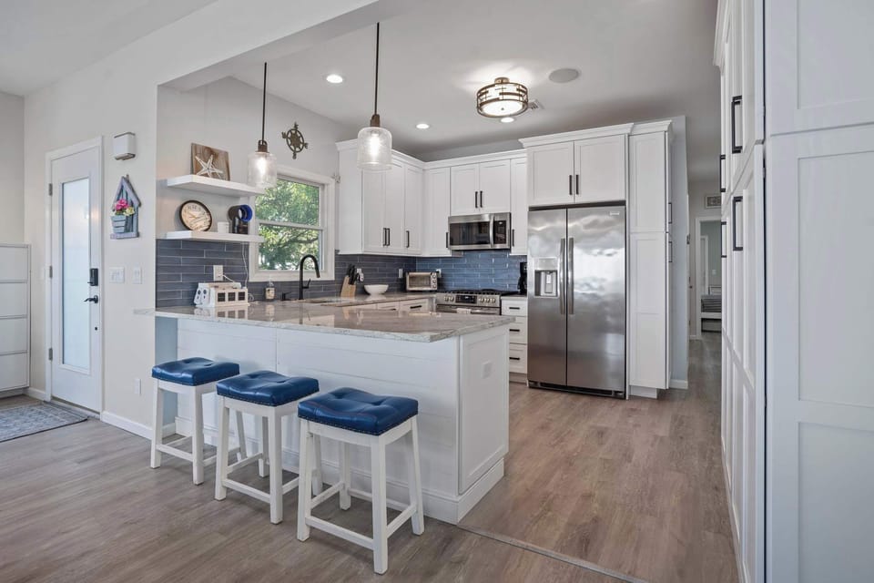 Inviting kitchen with 3 bar stools