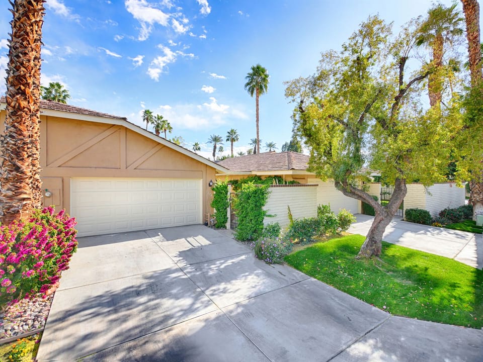 2 car garage and entrance to walkway to home is on the right.