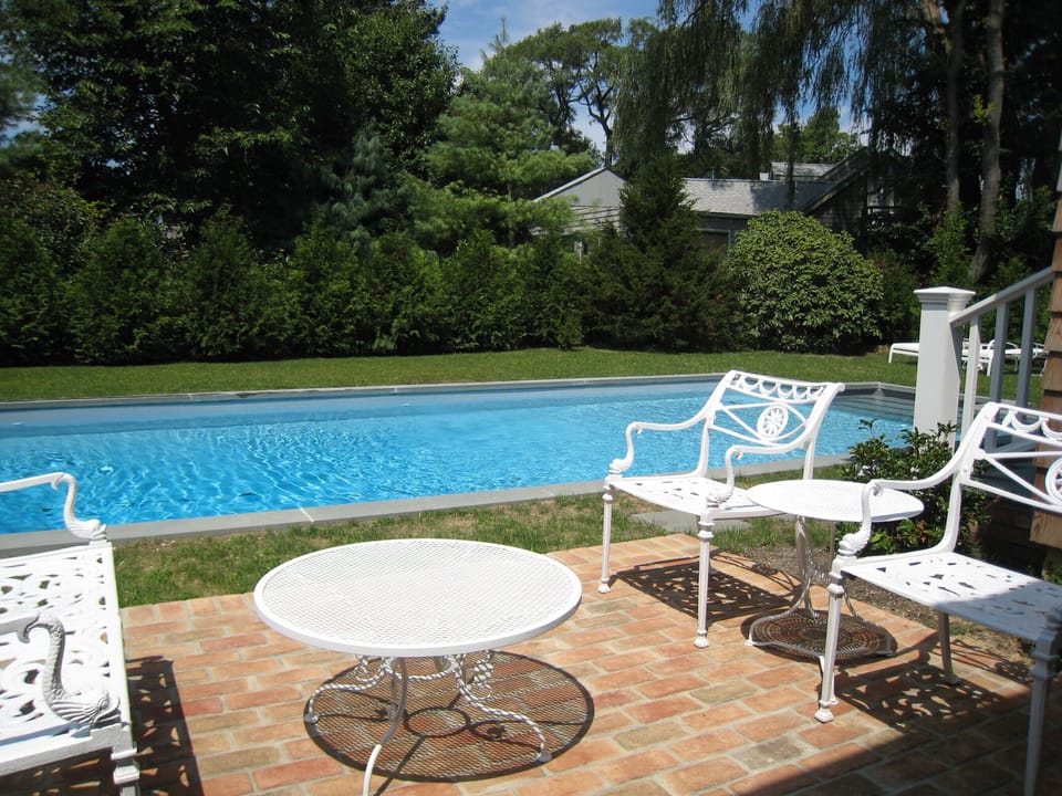 Relax poolside amidst professionally landscaped grounds.