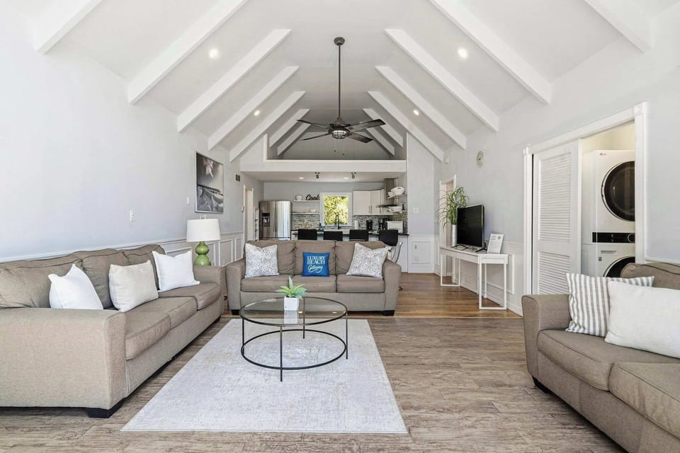 Open living room with vaulted ceilings and exposed beams