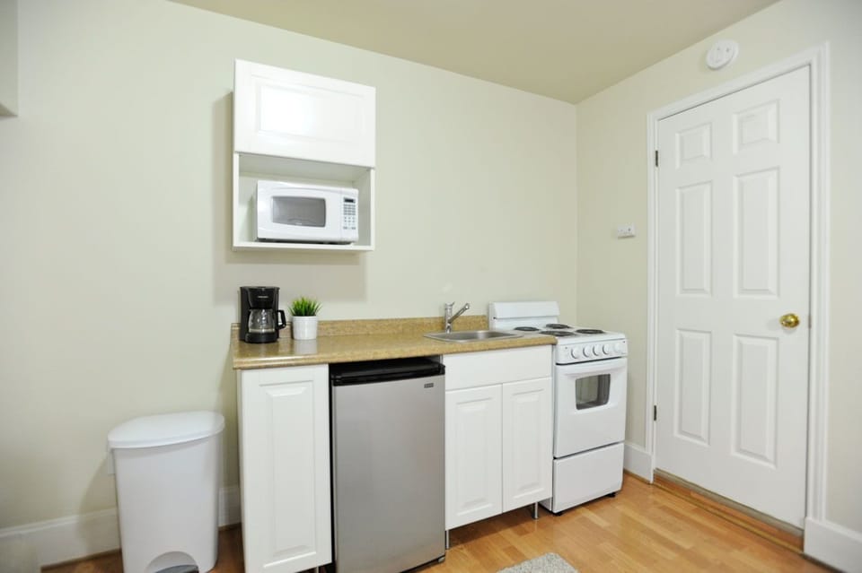 Kitchen with dining, pots, pans, plates