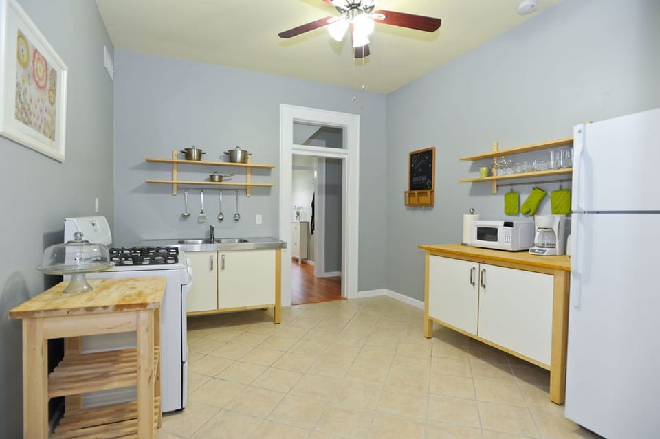 Kitchen with dining, pots, pans, plates