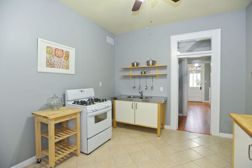 Kitchen with dining, pots, pans, plates